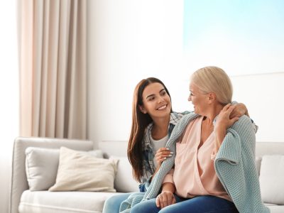 Daughter taking care of her mother at home. Help concept
